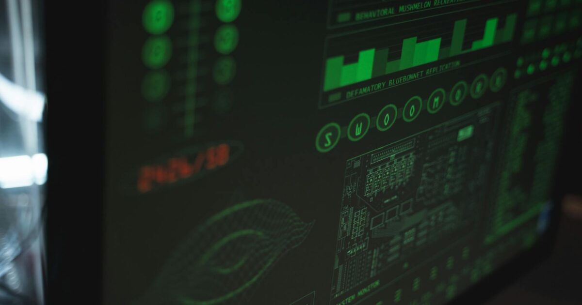Close-up view of a computer displaying cybersecurity and data protection interfaces in green tones.