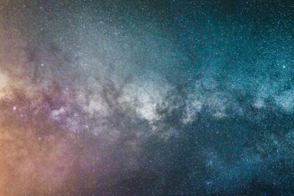 Stunning view of the Milky Way galaxy at night, showcasing countless stars and cosmic colors.